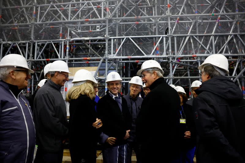 French President Macron visits Paris' Notre-Dame cathedral a year before its reopening