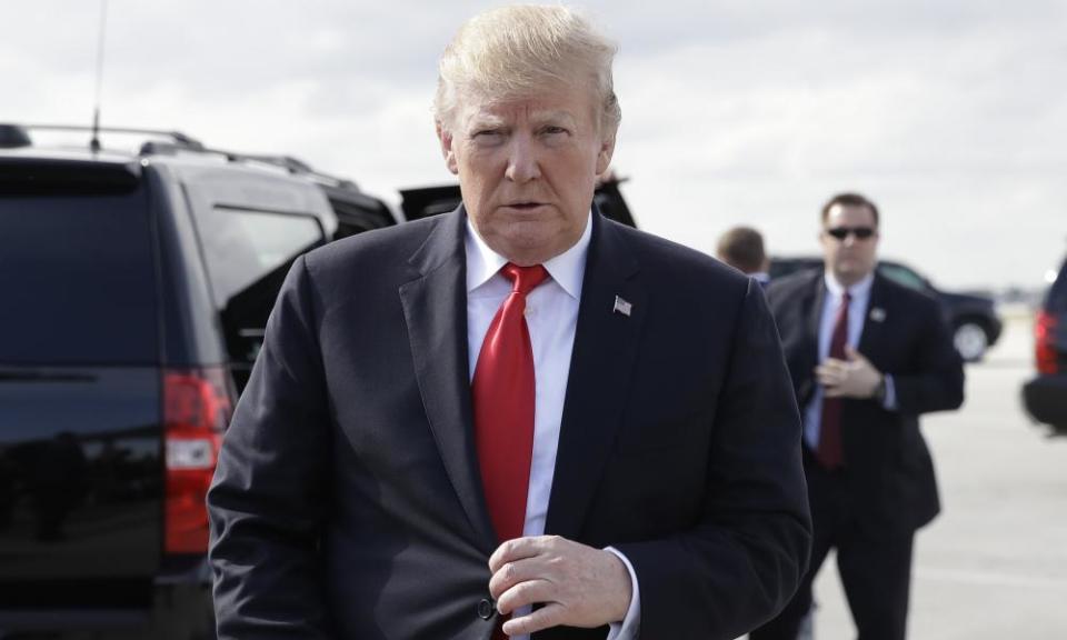 Donald Trump walks to talk to the media before boarding Air Force One in Florida.