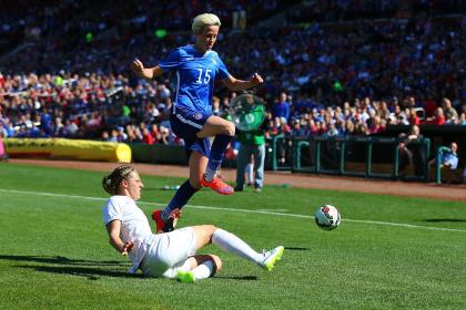 ST. LOUIS, MO - APRIL 4: Rebekah Stott #6 of New Zealand kicks the ball away from Megan Rapinoe #15 of the United States at Busch Stadium on April 4, 2015 in St. Louis, Missouri. (Photo by Dilip Vishwanat/Getty Images)