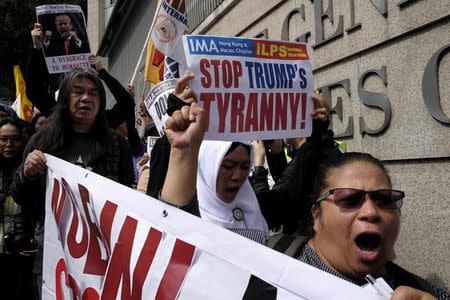 Protesters demonstrate against U.S. President Donald Trump's executive order on immigration, in Hong Kong, China February 5, 2017. REUTERS/Bobby Yip