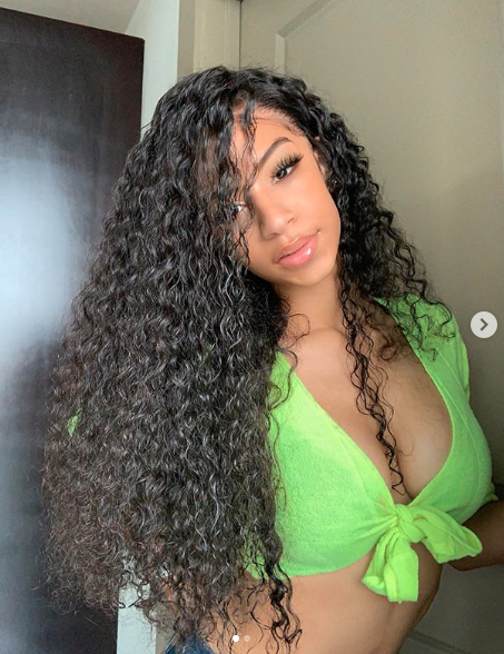 Deyjah Harris in a selfies wearing a bright green tie-up crop on her Instagram princess_of_da_south