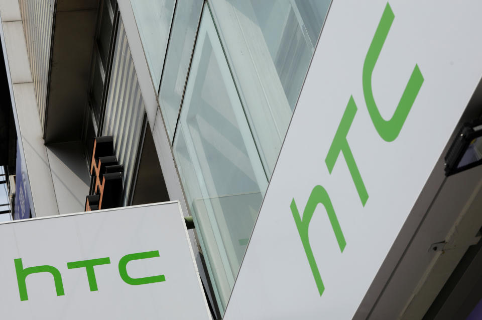 <p>Logos of HTC are seen outside its store in Taipei, Taiwan September 21, 2017. REUTERS/Tyrone Siu </p>