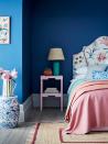 <p> Loving the vivid colors in this blue bedroom. And we know that pink and blue aren&apos;t a color combo you see all too often, but we think this space proves that that needs to change. A pop of pink furniture against a blue wall, or a mix of blue and pink throw pillows not only creates a fun contrast but softens all those cool tones too. And despite the quote bold mix, there&apos;s something very sophisticated about a vivid blue and peachy pink. </p>