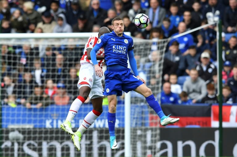 Leicester City's English striker Jamie Vardy (R) heads the ball during their English Premier League football match against Stoke City in Leicester on April 1, 2017