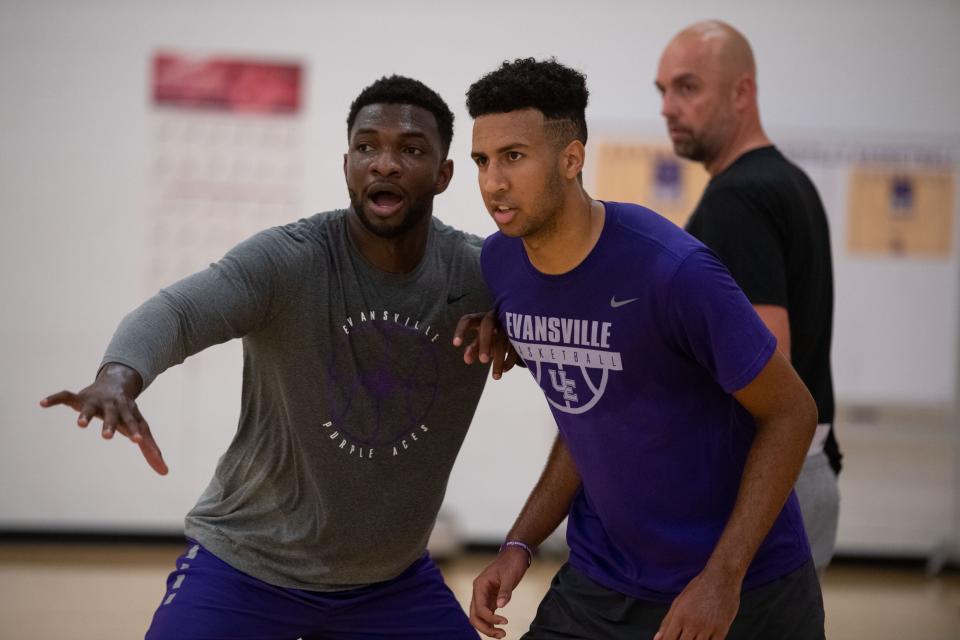 Sekou Kalle, left, and Preston Phillips, right, play during an exercise at the first UE Men's Basketball summer practice at Fifth Third Bank Practice Facility in Evansville, Ind., Tuesday, June 21, 2022.
