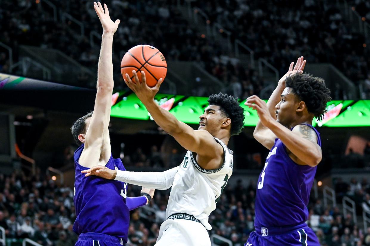 Michigan State's Jaden Akins attempts a layup against Northwestern during the first half on Sunday, Dec. 4, 2022, in East Lansing.