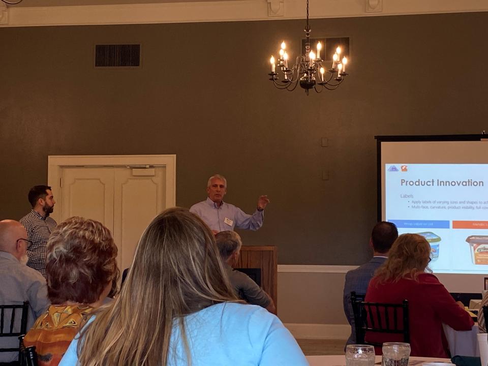 Jeff Lukas of IML Containers addresses an audience at the Alliance County Club on Tuesday, May 24, 2022.