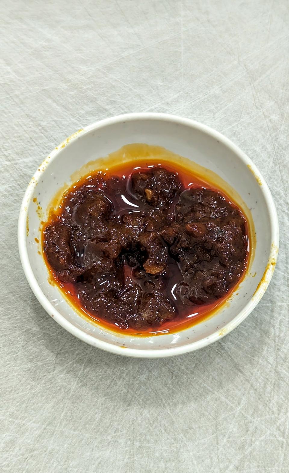 Spicy and slightly salty, the chilli paste here features bits of dried shrimps for a kick of umami.