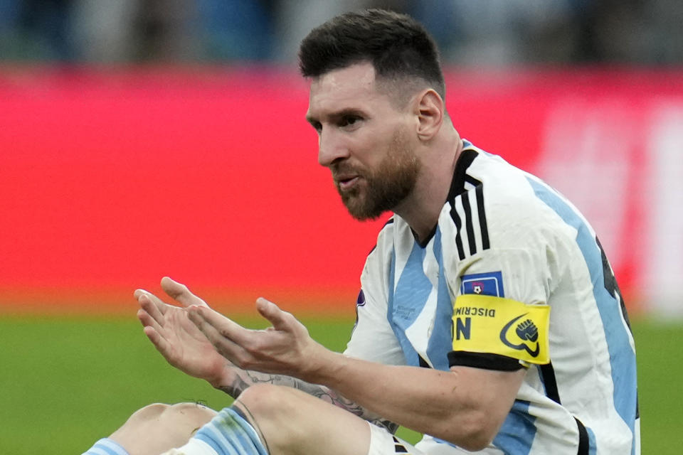 Argentina's Lionel Messi bleeds from his mouth after a clash during the World Cup quarterfinal soccer match between the Netherlands and Argentina, at the Lusail Stadium in Lusail, Qatar, Saturday, Dec. 10, 2022. (AP Photo/Ricardo Mazalan)