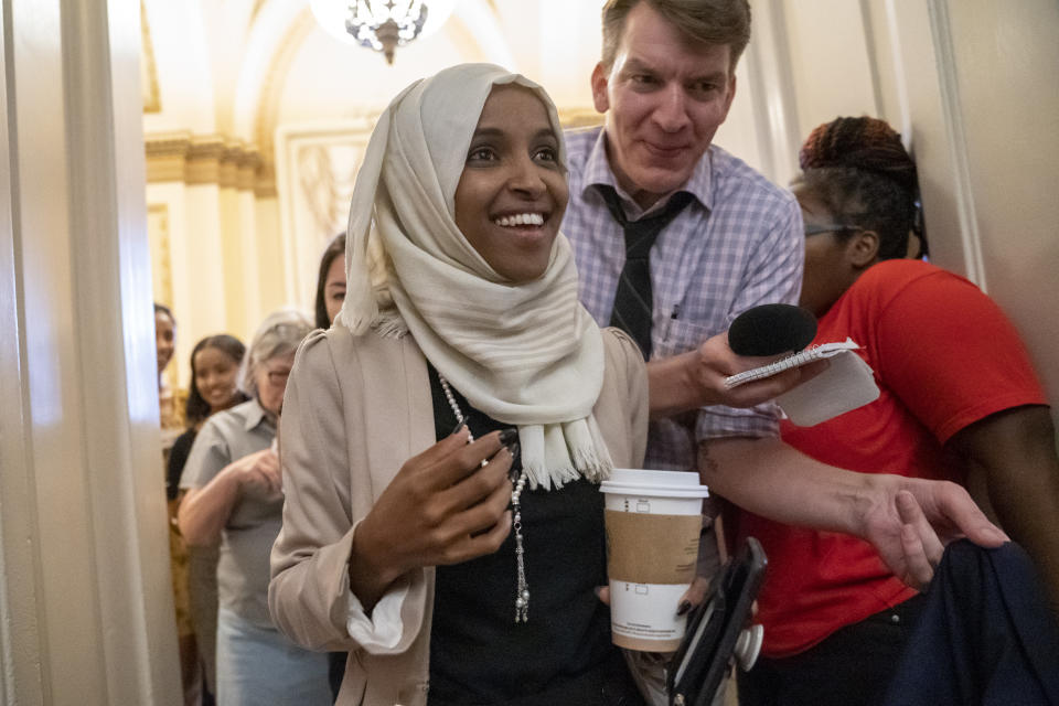 Rep. Ilhan Omar, D-Minn., a target of racist rhetoric from President Donald Trump, walks from the House to her office following votes, at the Capitol in Washington, Thursday, July 18, 2019. (AP Photo/J. Scott Applewhite)