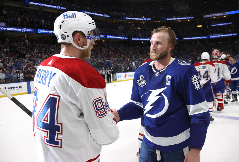 TAMPA, FLORIDA - JULY 07: Corey Perry #94 of the Montreal Canadiens and Steven Stamkos #91 of the Tampa Bay Lightning shake hands after the Tampa Bay Lightning 1-0 victory in Game Five of the 2021 Stanley Cup Final to win the series four games to one against the Montreal Canadiens at Amalie Arena on July 07, 2021 in Tampa, Florida. (Photo by Dave Sandford/NHLI via Getty Images)