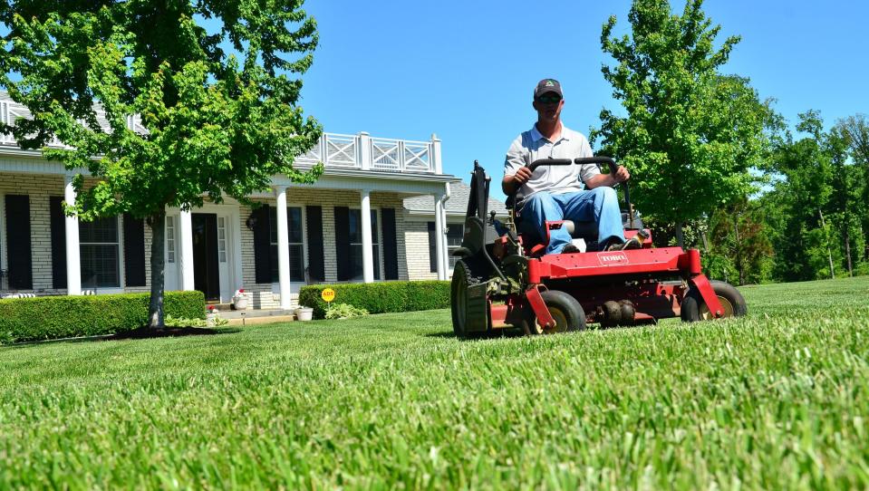 A person mowing a lawn on a zero turn riding lawn mower.
(File photo: provided by Gene Caballero)