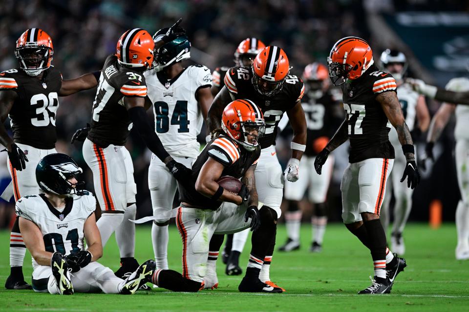 Cleveland Browns safety Ronnie Hickman Jr. (33) celebrates an interception with teammates Thursday against the Philadelphia Eagles in Philadelphia.