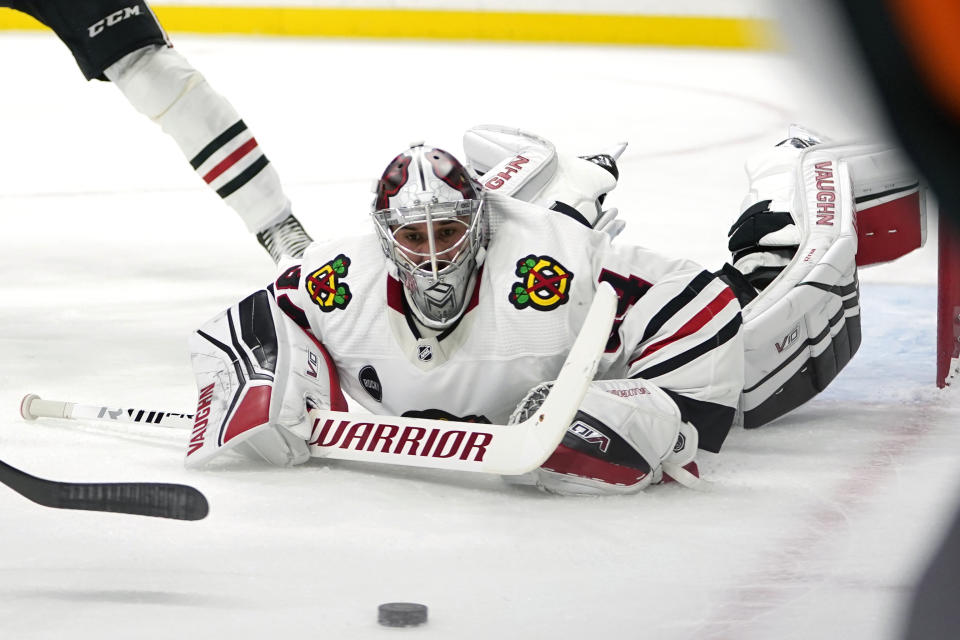 Chicago Blackhawks goaltender Petr Mrazek (34) watches the puck during the first period of an NHL hockey game against the Minnesota Wild, Sunday, Dec. 3, 2023, in St. Paul, Minn. (AP Photo/Abbie Parr)