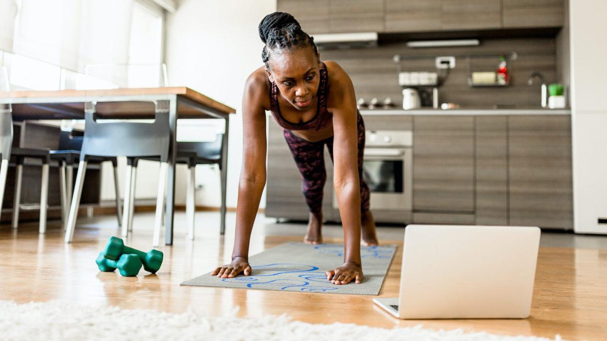 Woman doing push ups at home