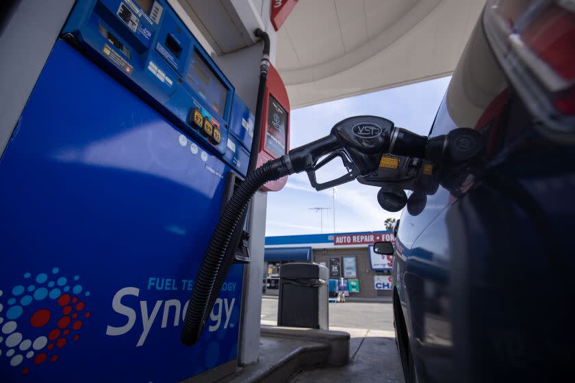 Huntington Beach, CA - February 16: A motorist fills up their Toyota Prius at a Mobile gas station on Beach Blvd. in Huntington Beach Thursday, Feb. 16, 2023. (Allen J. Schaben / Los Angeles Times)