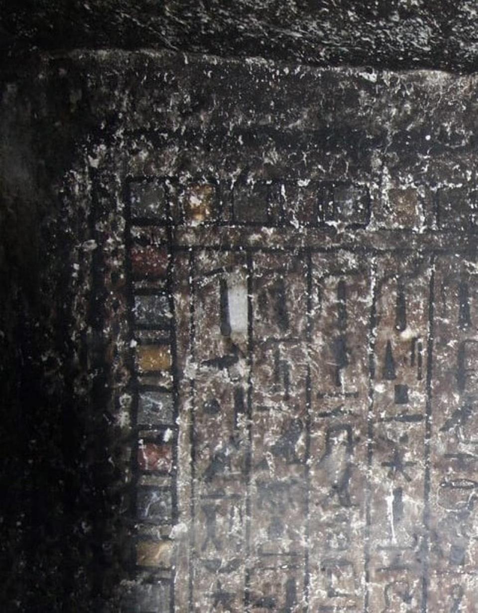The soot-covered paintings before restoration.
