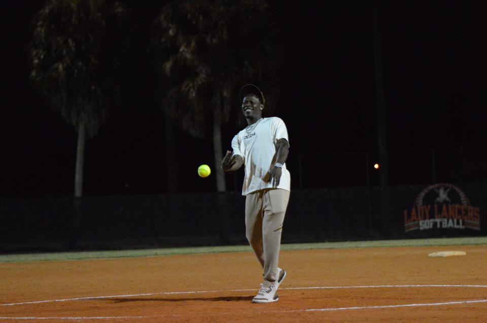 Jazz Chisholm throws the first pitch to John I. Leonard before they face Cardinal Newman in a pre-season game on Feb. 12, 2024.