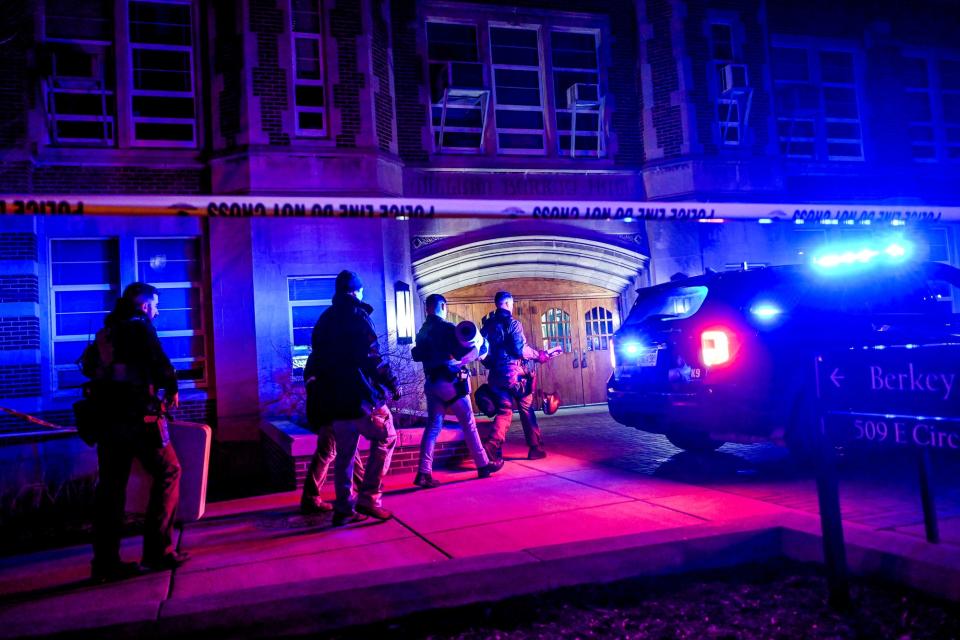 Police walk into Berkey Hall early on Feb. 14, 2023, on the Michigan State campus in East Lansing.