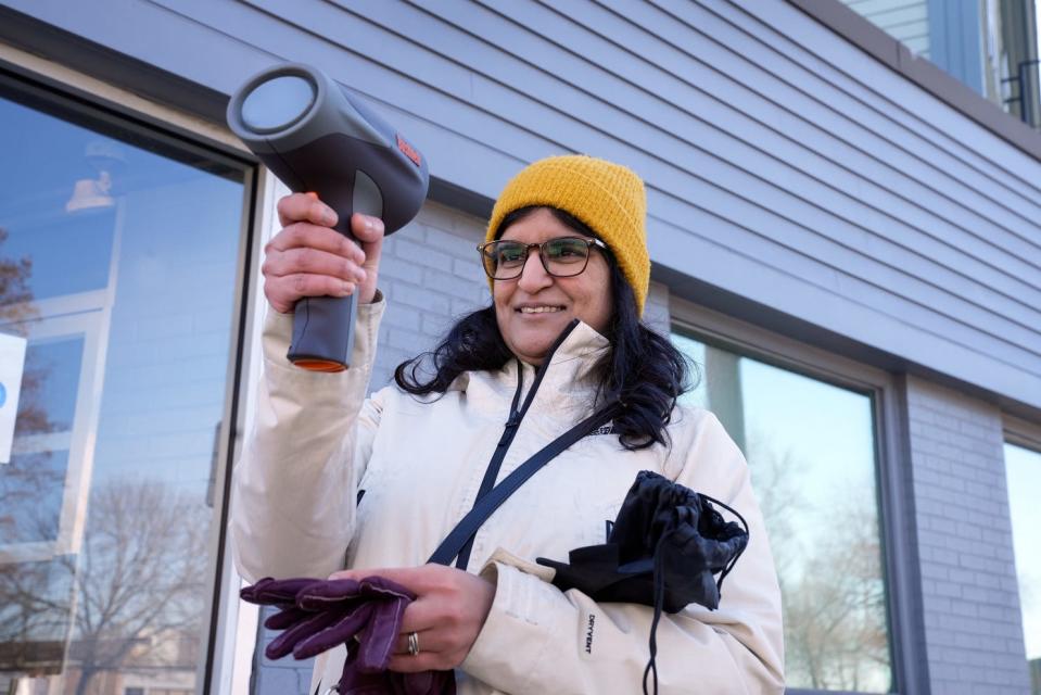 Transportation engineer Rosie Jaswal, a member of Providence's new North Main Street Task Force, uses a radar gun to clock the speed of drivers. Most exceeded the street's 25 mph limit.