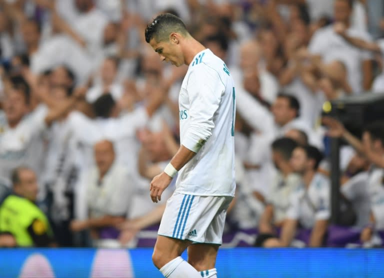 Real Madrid's forward from Cristiano Ronaldo looks downwards during the Spanish league football match against Real Betis at the Santiago Bernabeu stadium in Madrid on September 20, 2017