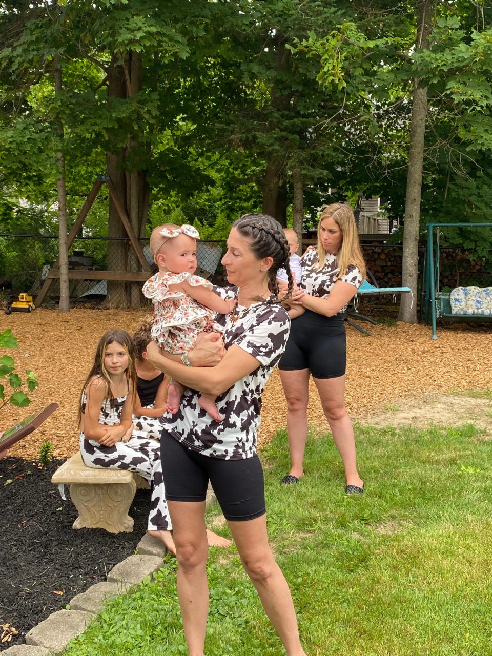 Mother of quadruplets Ashley Ness of Taunton holds her baby daughter Chatham at her home on July 29, 2023 at the babies' first birthday party.