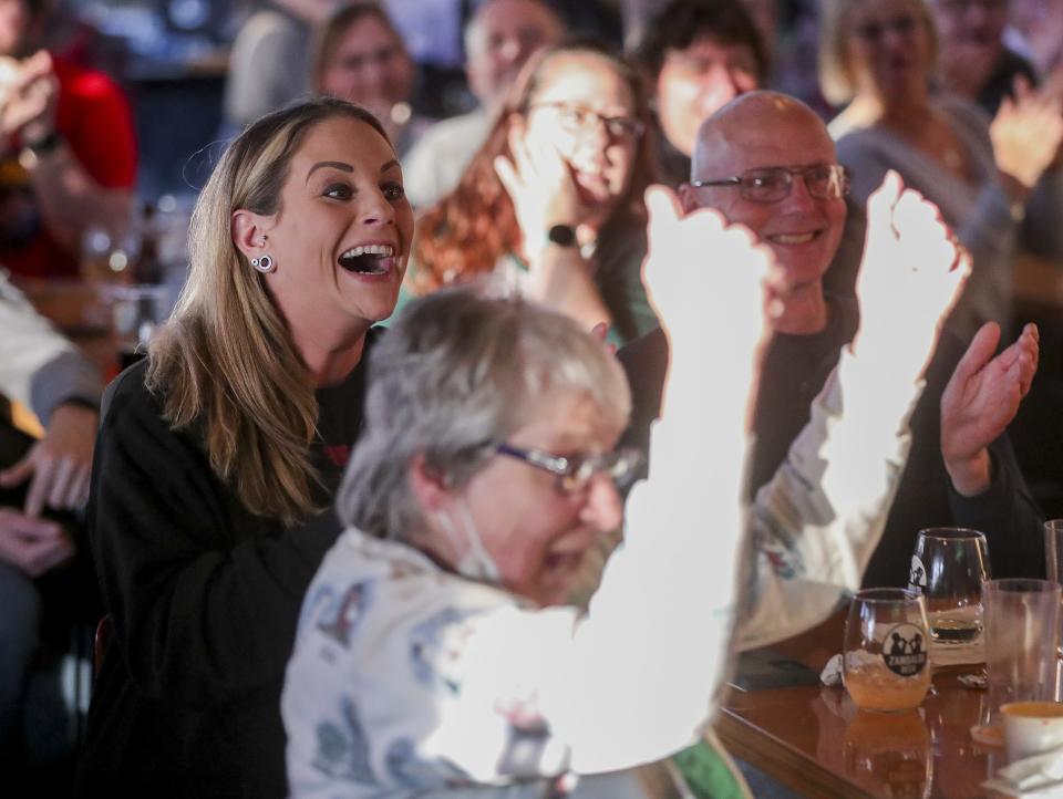Rebecca Austin reacts after Green Bay's Ben Chan chooses a Daily Double during a watch party for the "Jeopardy!" Tournament of Champions on Tuesday at Zambaldi Beer in Allouez.
