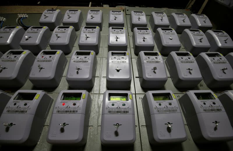 FILE PHOTO: Electric meters of an apartment building are seen in Barcelona