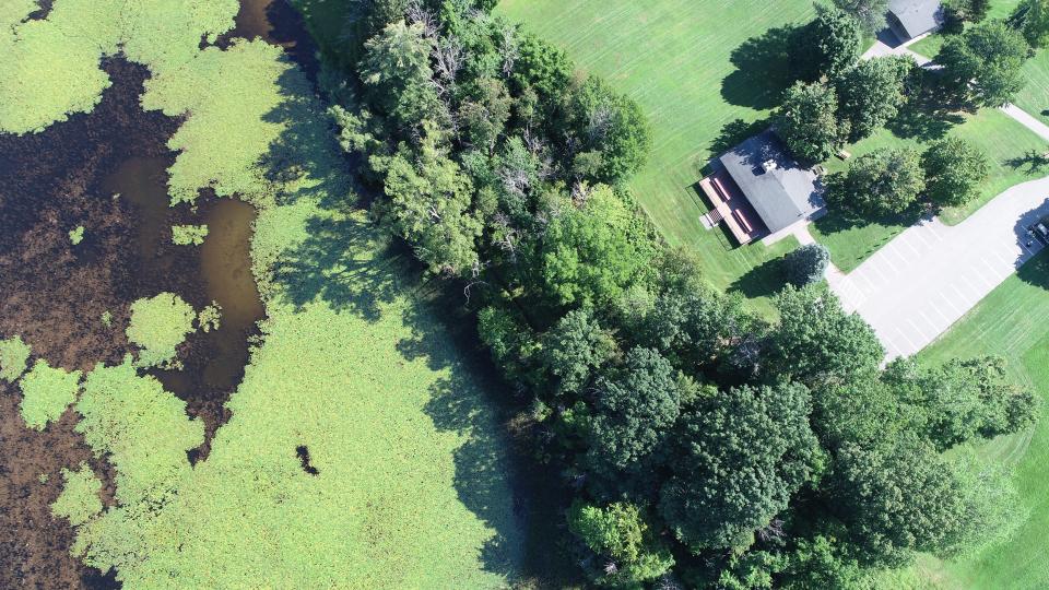 Stewart Lodge in Mendon Ponds Park is close to Hundred Acre Pond, a playground and open fields.