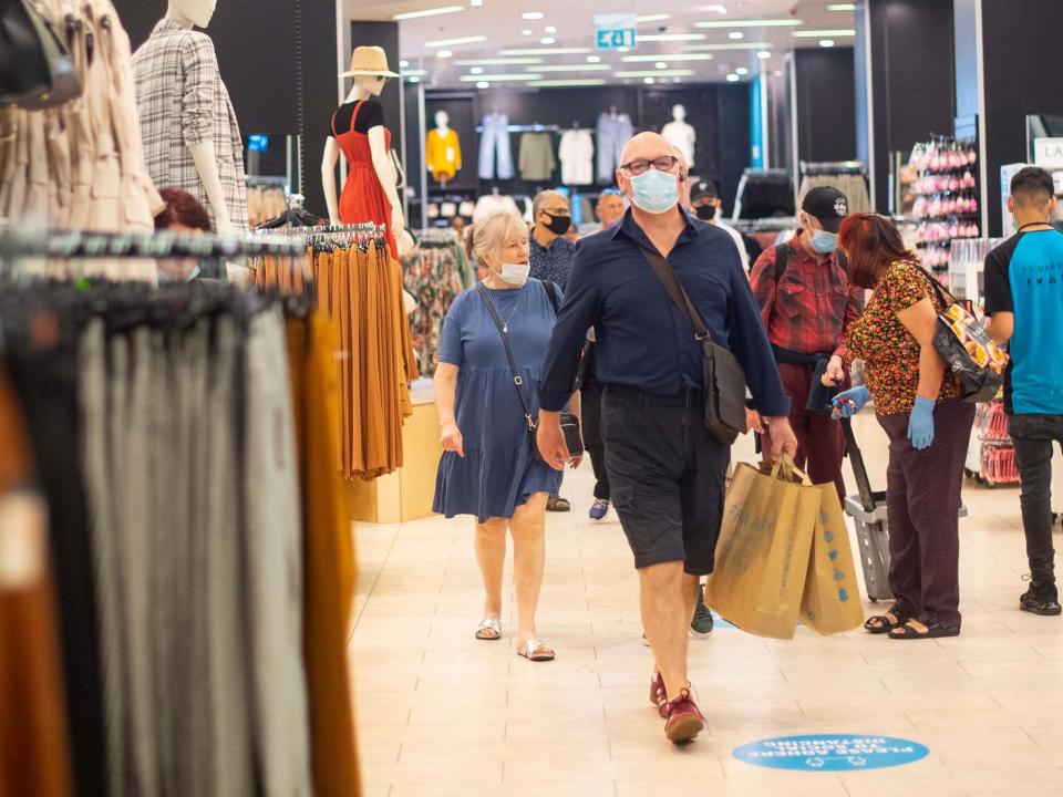 File photo of customers wearing face masks as they shop at Primark in Oxford Street, London: PA