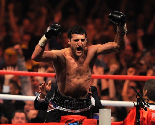 Carl Froch of Britain celebrates a win in Nottingham in May. Froch said Sunday that his world champion compatriot Amir Khan should think about retirement following his defeat by Danny Garcia in Las Vegas on Saturday night