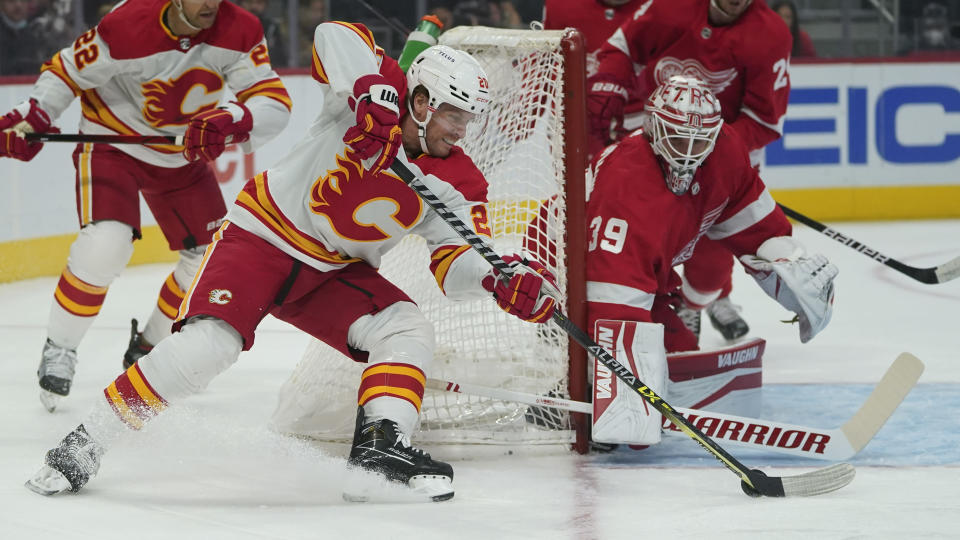 Detroit Red Wings goaltender Alex Nedeljkovic (39) stops a Calgary Flames center Blake Coleman (20) shot in the first period of an NHL hockey game Thursday, Oct. 21, 2021, in Detroit. (AP Photo/Paul Sancya)