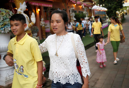 Duangpet Promtep and his family arrive to attend a religious ceremony, in a temple at Mae Sai, in the northern province of Chiang Rai, Thailand, July 19, 2018. REUTERS/Soe Zeya Tun