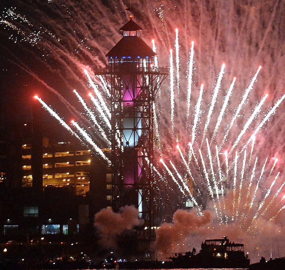 Fireworks explode over Dobbins Landing and the Bicentennial Tower during Lights Over Lake Erie in Erie on July 3, 2019.