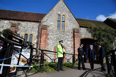 Britain's Prime Minister Theresa May stands outside The Mill pub during a visit to the city where former Russian intelligence officer Sergei Skripal and his daughter Yulia were poisoned with a nerve agent, in Salisbury, Britain March 15, 2018. REUTERS/Toby Melville/Pool