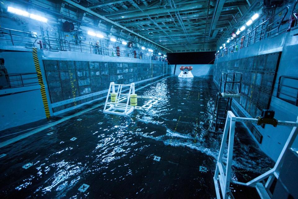 This Wednesday Feb. 19, 2014 photo released by NASA shows a test version of the Orion spacecraft, tethered inside the well deck of the USS San Diego prior to testing between NASA and the U.S. Navy. NASA and the Navy suspended the test Thursday, Feb. 20, 2014 off the coast of San Diego after a problem was discovered. (AP Photo/NASA)