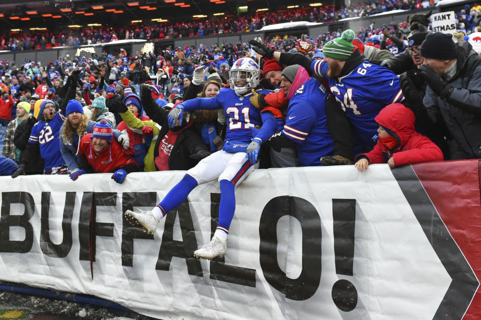 Bills safety Jordan Poyer celebrates with fans in Buffalo's victory against Miami last month. (AP) 