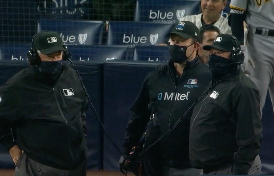 MLB umpires review a play