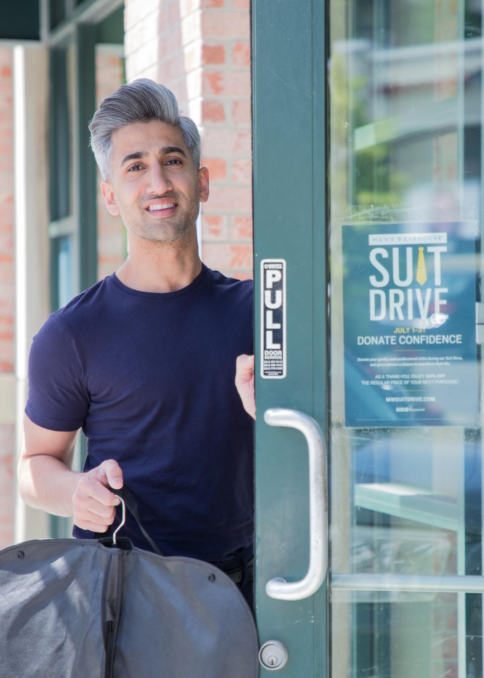 Style expert Tan France donates a suit for a good cause at a Men's Wearhouse store in Salt Lake City. (Photo: C. Wilson Photography) 