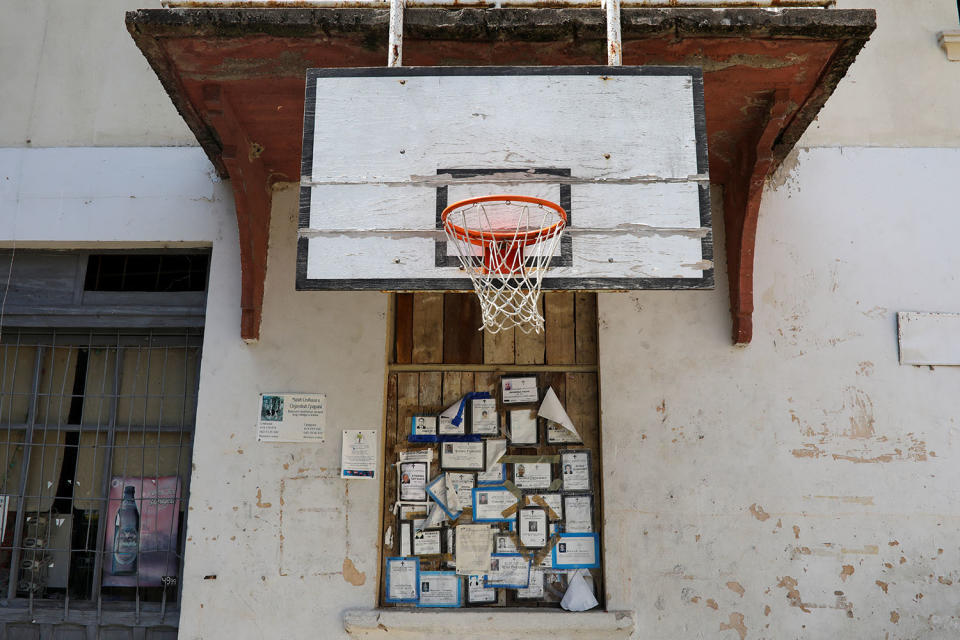 <p>Death notices are seen on a wall below a basketball board in the village of Strbac, near the southeastern town of Knjazevac, Serbia, Aug. 15, 2017. (Photo: Marko Djurica/Reuters) </p>