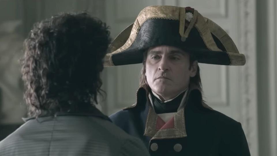 Joaquin Phoenix as Napoleon Bonaparte in film trailer wearing his famous military hat 