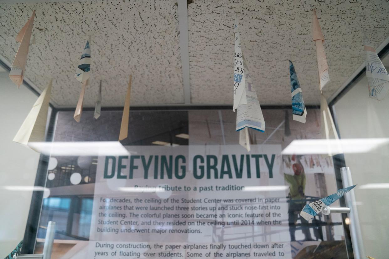 An encased display on the second floor of the Wayne State University Student Center shows paper airplanes stuck to a sampling of drop ceiling. Now this old tradition lives in a mural on the first floor at the Community Financial Credit Union on Monday, Jan. 22, 2024.