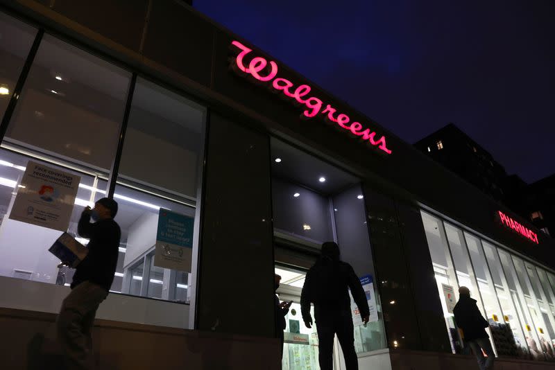 People walk by a Walgreens, owned by the Walgreens Boots Alliance, Inc., in Manhattan, New York City