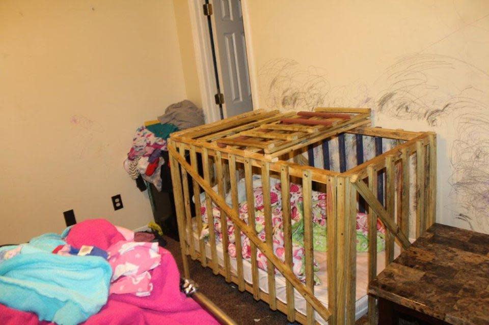 Investigators with the Lee County Sheriff's Office in Alabama say five children were kept in 'cages' inside a home in Smith Station outside Columbia: Lee County Sheriff's Office