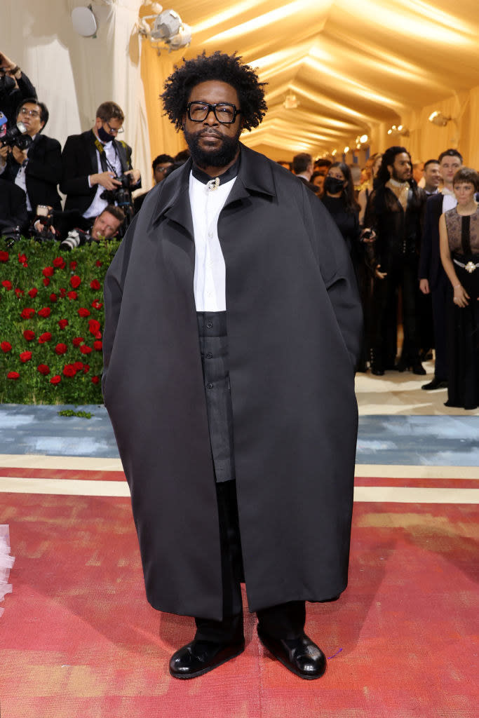 Questlove wearing a cape