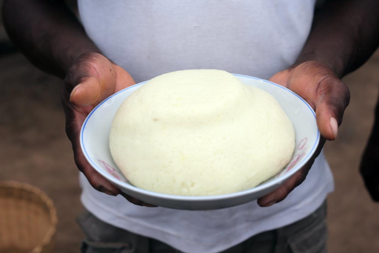 A plate of fufu, a meal common in West Africa. <a href="https://www.gettyimages.com/detail/news-photo/traditional-african-meal-cassava-togo-news-photo/929274752?adppopup=true" rel="nofollow noopener" target="_blank" data-ylk="slk:Godong/Universal Images Group via Getty Images;elm:context_link;itc:0;sec:content-canvas" class="link ">Godong/Universal Images Group via Getty Images</a>