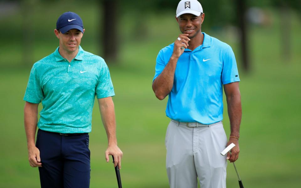 Rory McIlroy of Northern Ireland talks to Tiger Woods of the United States on the tenth green during the first round of The Memorial Tournament - Andy Lyons/Getty Images