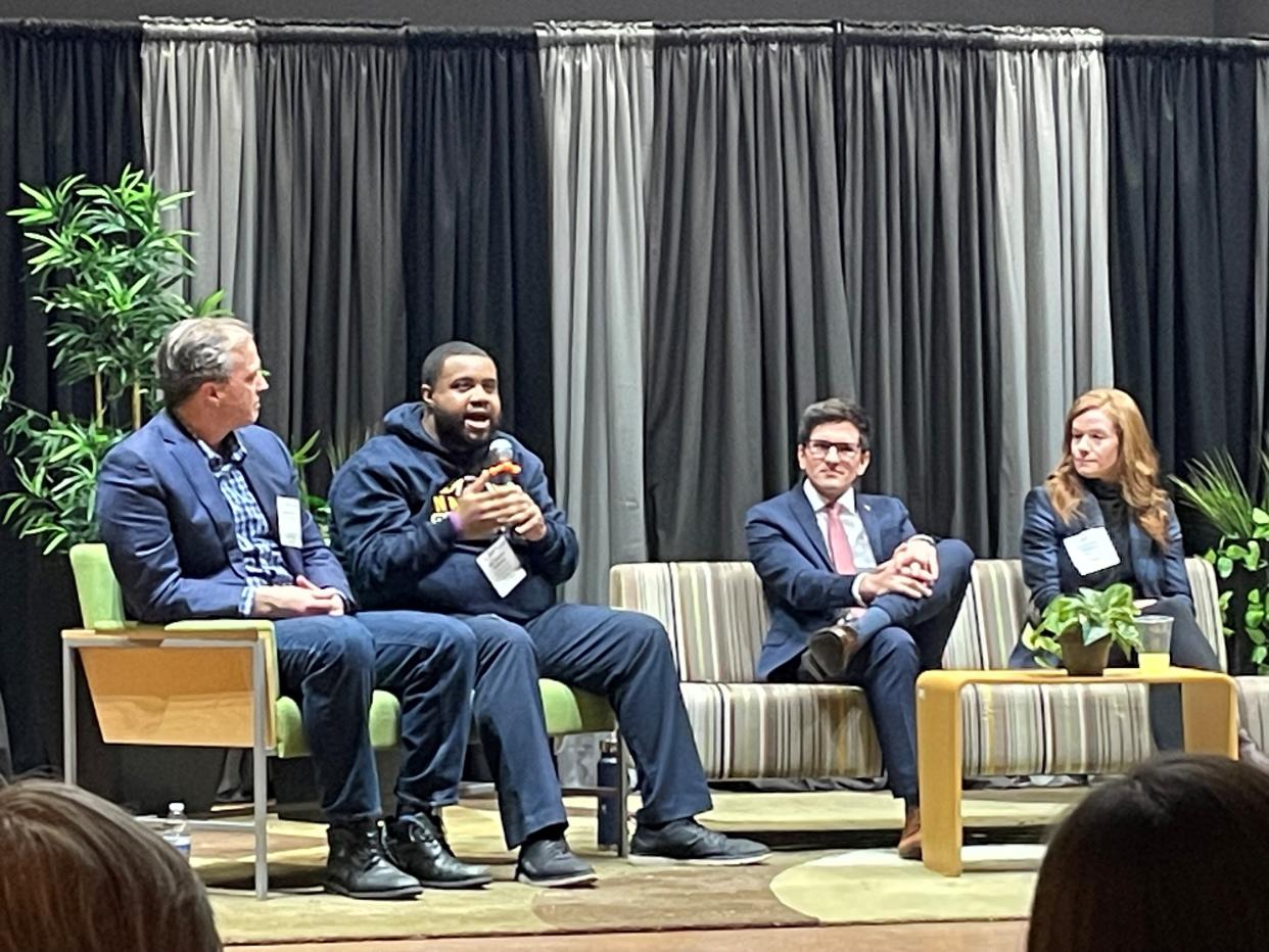 State Rep. Donavan McKinney, second from left, speaks during a panel discussion at the State of Transit 2024 event in Detroit on Tuesday night as state Sen. Jeff Irwin, left, state Rep. Jason Morgan, second from right, and state Sen. Mallory McMorrow listen.