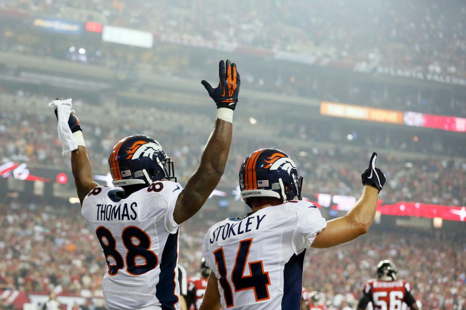 ATLANTA, GA - SEPTEMBER 17: Wide receiver Demaryius Thomas #88 and wide receiver Brandon Stokley #14 of the Denver Broncos celebrate after a touchdown in the second quarter against the Atlanta Falcons during a game at the Georgia Dome on September 17, 2012 in Atlanta, Georgia. (Photo by Kevin C. Cox/Getty Images)