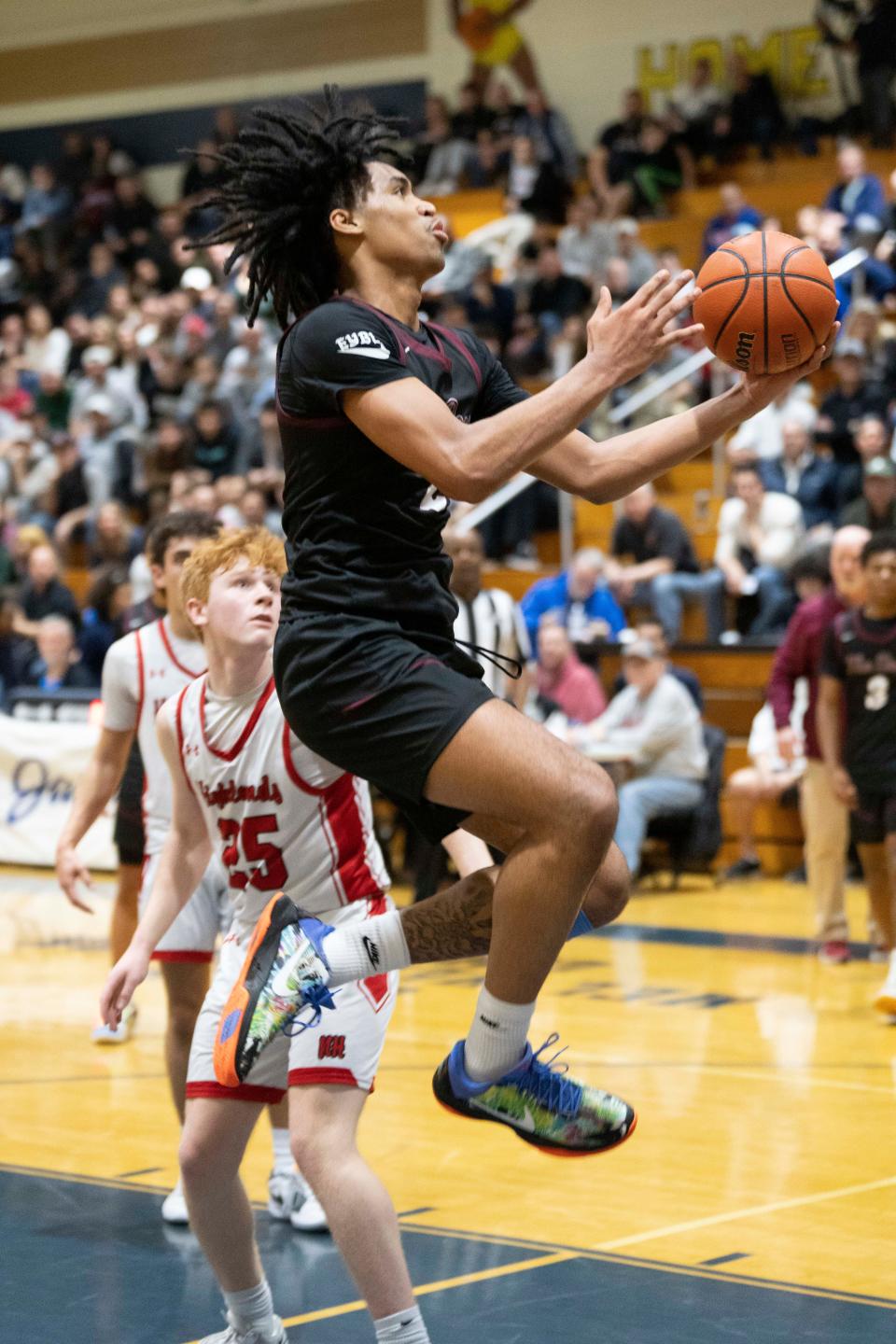Feb 10, 2024; Hackensack, New Jersey, United States; Don Bosco vs. Northern Highlands in a Bergen County Jamboree boys basketball semifinal game at Hackensack High School. DB #2 Dylan Harper drives to the basket.